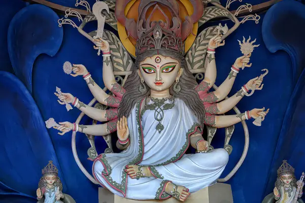 stock image Idol of Goddess Devi Durga at a decorated puja pandal in Kolkata, West Bengal, India. Durga Puja is a famous and major religious festival of Hinduism that is celebrated throughout the world.