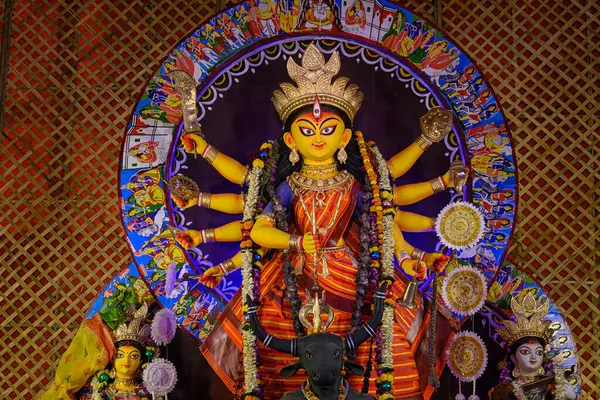 Stock image Idol of Goddess Devi Durga at a decorated puja pandal in Kolkata, West Bengal, India on October 22, 2023. Durga Puja is a major religious festival of Hinduism that is celebrated globally.