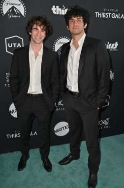 Beverly Hills, CA USA - May 18, 2024: Zachary Gordon, Nour Khodr attends The Thirst Projects 15th Annual Thirst Gala. clipart