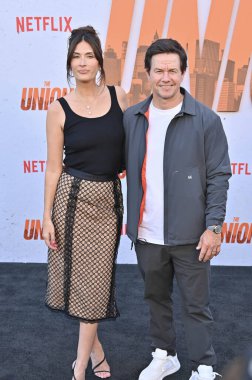 Hollywood, CA USA - August 12, 2024: Rhea Durham, Mark Wahlberg attends the premiere of Netflix's The Union. clipart