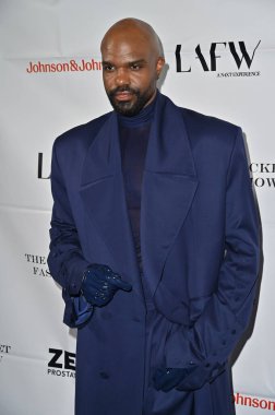 Hollywood CA USA - November 13, 2024: Carl Clemons-Hopkins attends the Blue Jacket Fashion Show Los Angeles. clipart