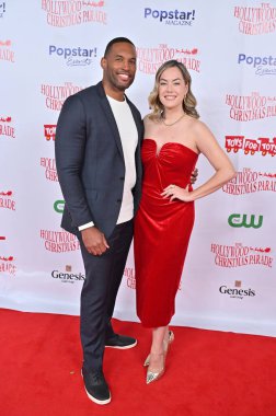 Hollywood, CA USA - December 1, 2024: Lawrence Saint-Victor, Annika Noelle attends the 92nd Annual Hollywood Christmas Parade. clipart