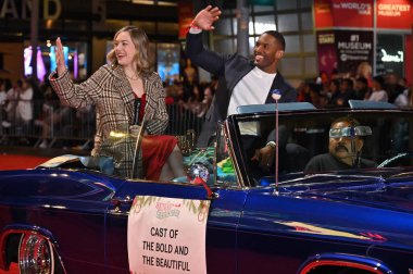 Hollywood, CA USA - December 1, 2024: Annika Noelle, Lawrence Saint-Victor  attends the 92nd Annual Hollywood Christmas Parade. clipart