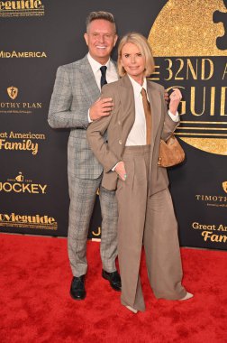 Hollywood, CA USA - February 7, 2025: Mark Burnett, Roma Downey attends 32nd Annual Movieguide Faith and Values Awards clipart