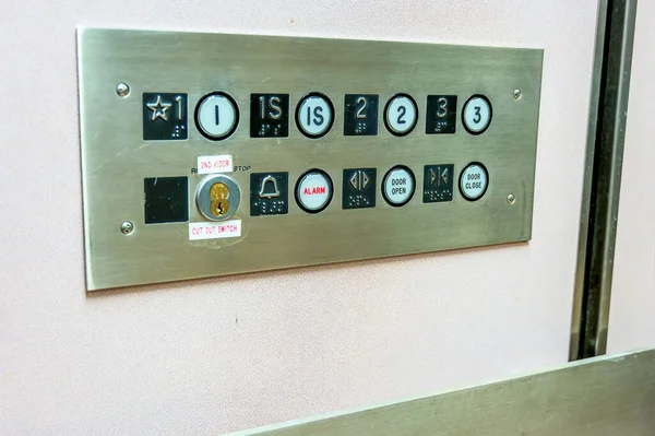 Metallic Elevator control panel with push buttons to floor or occupants. High quality photo