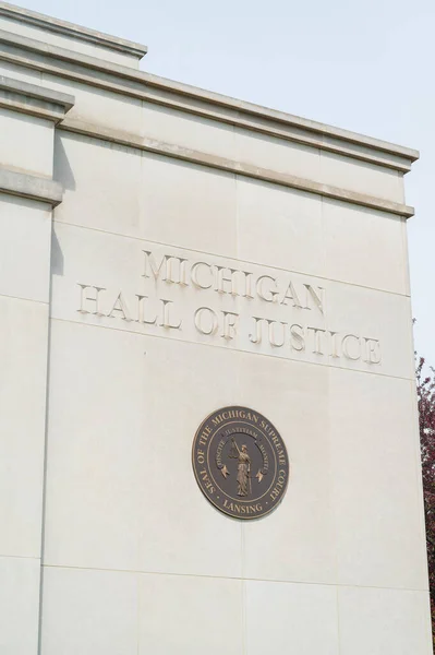 stock image Lansing MI - May 6, 2023: State of Michigan seal on the Michigan Hall of Justice Building. High quality photo
