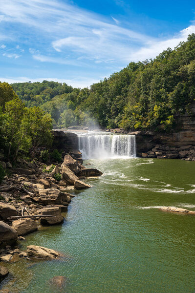 Cumberland Falls with a blue sky with clouds in Corbin, Kentucky, USA. High quality photo