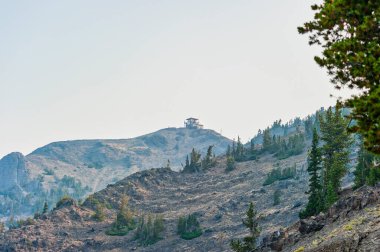 Fire Lookout Tower on Mount Washburn in Yellowstone National Park with Copy-Space. High quality photo clipart