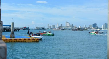 Pattaya Pier has tourists And many speed boats are parked..It is a tourist attraction in Pattaya. Recorded on April 20, 2022 at Pattaya Pier, Thailand.	