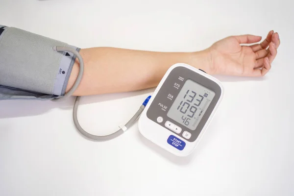 Woman Measures Blood Pressure Copy Space White Background — Stock Photo, Image