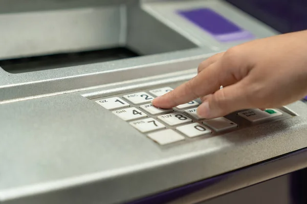 stock image Finger pressing password number on ATM machine