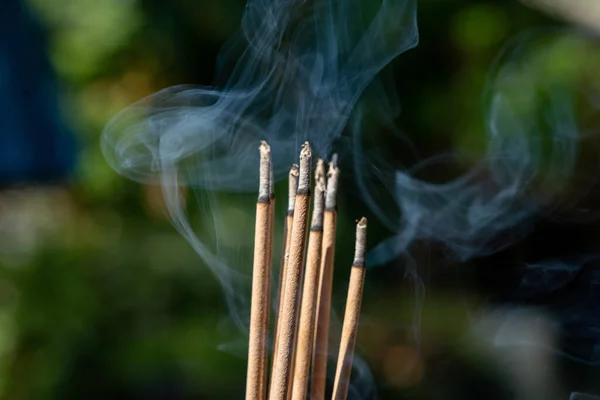 stock image Close-up of burning 9 incense sticks outdoors is an Asian belief.