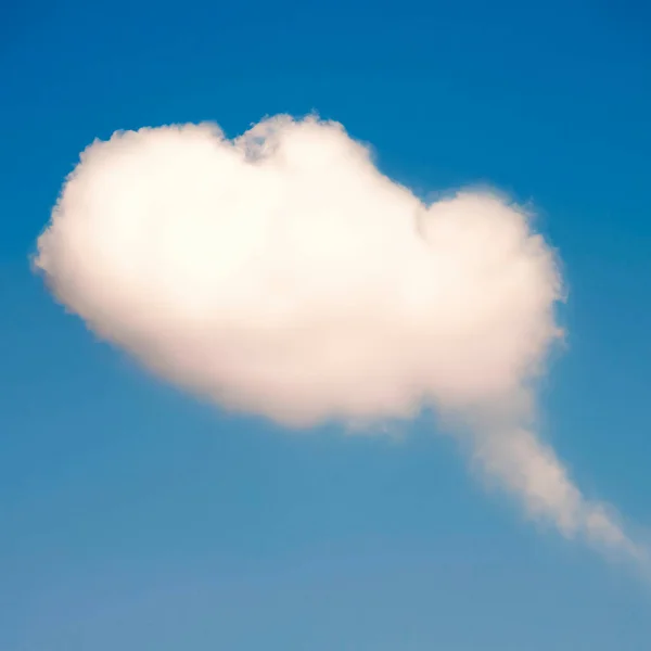 Cloud with comic bubble shape in blue sky.