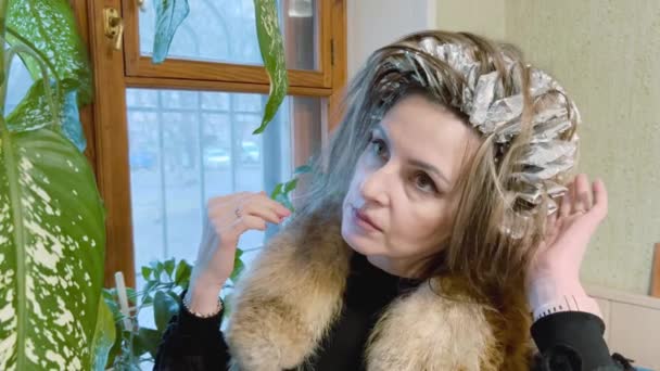 Funny Strange Woman Unusual Hairstyle Adjusts Her Hair Standing Window — Video Stock