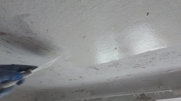 Scrape Old Paint Ceiling Using Putty Knife — Stock Video