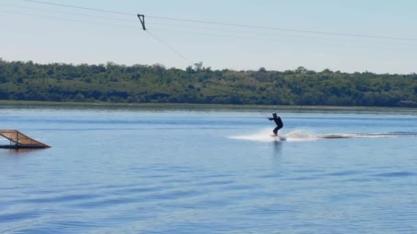 Unrecognizable Silhouette Man Surfing River Jumping Springboard — Stockvideo
