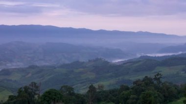 The morning fog on the eastern side saw the movement of orange clouds hitting the sun at Phu Lanka, Phayao Province, Thailand.
