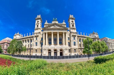 Budapest, Hungary - July 04, 2022: Opposite the Parliament building, the Palace of Justice is one of the most beautiful buildings on Kossuth Square.