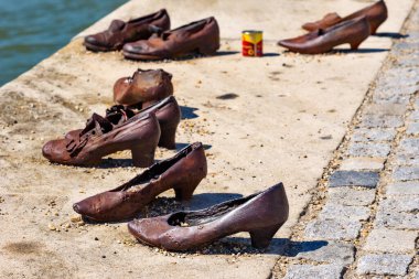 Budapest, Hungary - July 04, 2022: Shoes on Danube embankment (Memorial to World War II victims), Budapest, Hungary. Shoes Memorial for Jews killed besides the Danube in Budapest