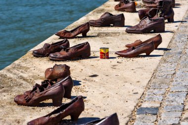 Budapest, Hungary - July 04, 2022: Shoes on Danube embankment (Memorial to World War II victims), Budapest, Hungary. Shoes Memorial for Jews killed besides the Danube in Budapest