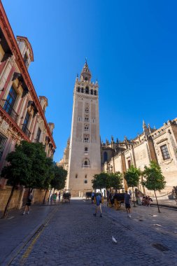 Seville, Spain - August 01, 2024: Sevilla Cathedral (Catedral de Santa Maria de la Sede), Gothic style architecture in Spain, Andalusia. Historic buildings and monuments of Seville, Spain. clipart