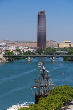 Seville, Spain - August 01, 2024: Guadalquivir river cityscape, Seville, Spain clipart