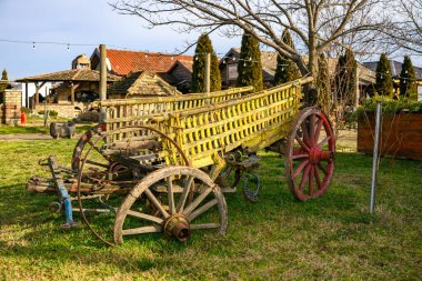 Novi Sad, Serbia- January 26, 2025: Vojvodina farm (Serbian; Vojvodjanski Sala) a beautiful restaurant near Novi Sad. Rural scene, old part of horse car. Old Farming Chariot  clipart