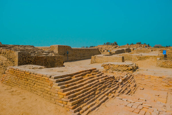 View of the ruins of the ancient city of Mohenjo Daro Indus Civilization in the background of the blue sky