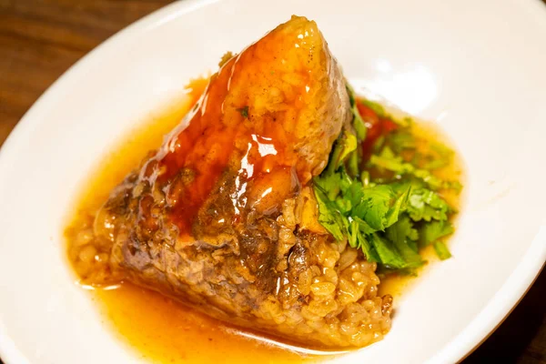 Stock image There is a steaming meat dumpling in a magnetic bowl on the table