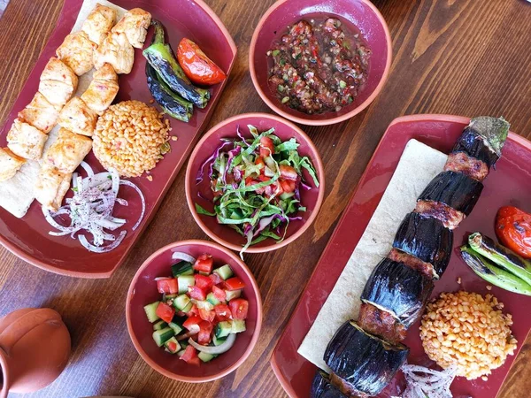 grilled meat with eggplant and vegetables, spices and sallad