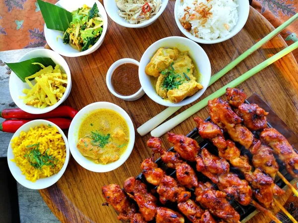 Fried Rice with chicken satay, rice, Vegetables and appetizer