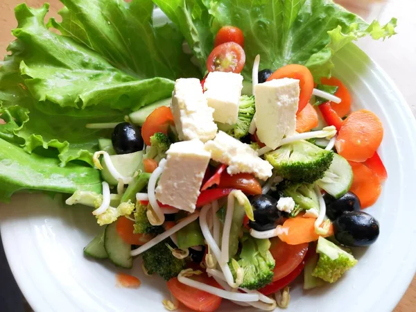 Mix salad from fresh vegetables and greens herbs Cesar sallad