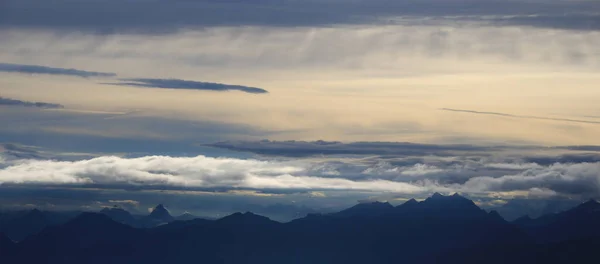 Moody sky over mountain ranges in Central Switzerland.