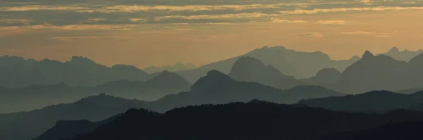 stock image Mountain ranges at sunrise, view from Rigi Kulm, Switzerland.