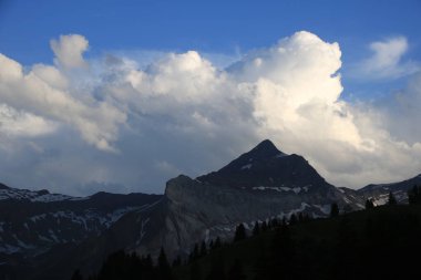 Bright lit cumulus cloud over Mount Oldehore.