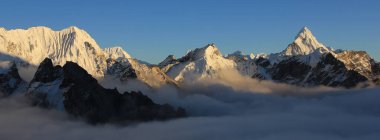 Snow covered peaks seen from Kala Patthar, Nepal. clipart