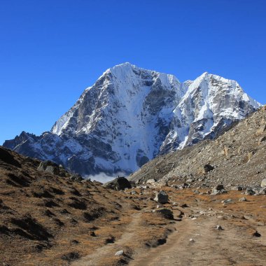 Mountains Tobuche and Tabuche seen from Lobuche, Nepal. clipart