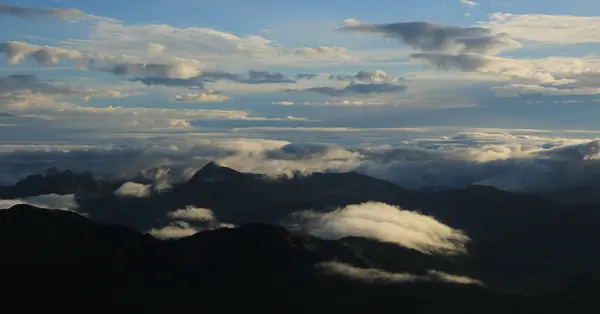 stock image Bright lit clouds over hills in the Entlebuch Region, Switzerland.