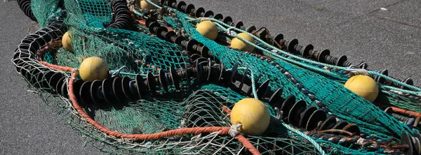 stock image Detail of a colorful big fishing net drying in the harbour of Hirtshals, Denmark.