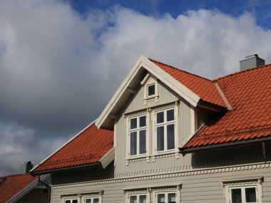 Decorated windows of a timber house in Egersund, Norway. clipart