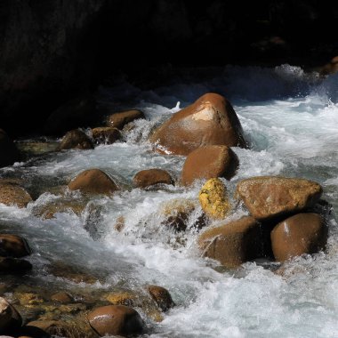 Boulder in the Dudhkoshi, river in Solukhumbu, Nepal. clipart