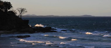 Waves at sunset, Port Maquarie, Australia. clipart