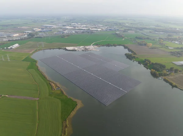 Largest floating solar park in Europe on a sand extraction lake, Bomhofsplas in Zwolle, The Netherlands. Sustainable renewable energy extraction.
