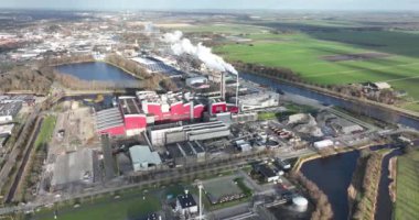 A waste incineration plant in the Netherlands, using advanced technologies to burn and convert waste into energy, reducing pollution and carbon footprint, while managing and disposing of waste in an