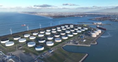 Aerial drone footage of LNG Facility on the Maasvlakte 2 in Rotterdam showcases the vast infrastructure, modern technology and the scale of operations at the facility. Aerial overhead view.