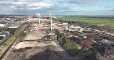 Aerial drone video showcasing the process of sorting and recycling waste materials at a landfill facility, emphasizing the technology and operations used to promote sustainable waste management