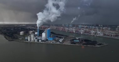 Aerial drone video showcasing Power plant in Rotterdam on the Maasvlakte harbour, highlighting the scale and technology of the power generation industry, the infrastructure and the integration with