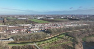 Soar high above the Kijfhoek train emplacement with this stunning aerial drone video, showcasing the intricate network of tracks and locomotives