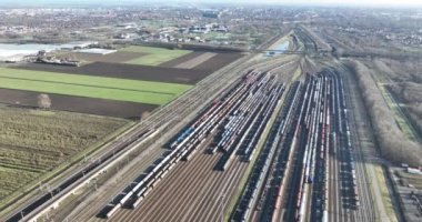 Spectacular aerial drone footage of Kijfhoek train depot presents a birds eye view of the bustling rail operations, emphasizing the size and importance of this transportation hub.