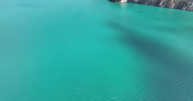 Stunning aerial drone video of Swiss lake and mountain road in the Alps, offering a breathtaking aerial view of the picturesque landscapes and breathtaking scenery, showcasing the natural beauty of